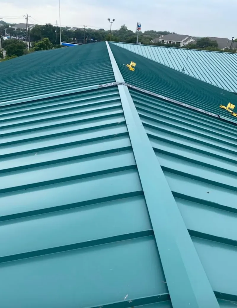 Green commercial metal roof ridge and valley for Metal Roof Repair in Liberty